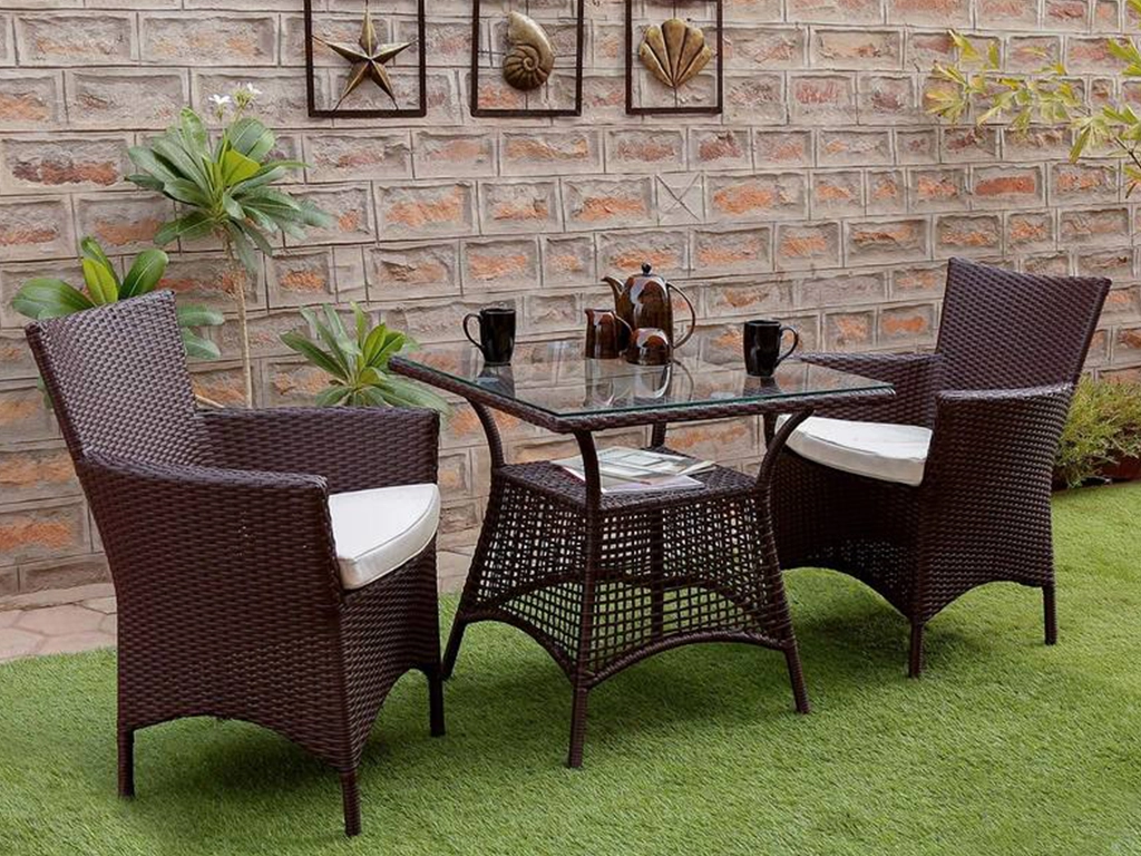 two pcs Brown color Patio design wicker chair with white color cushion and one pcs square center table with glass for outdoor.