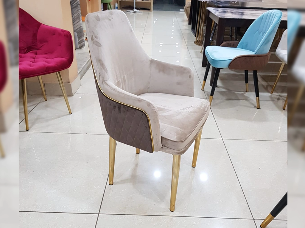 Beige & Brown color Chair With gold PVD piping on back, velvet upholstered back and seat, metal gold PVD electroplated finish legs.