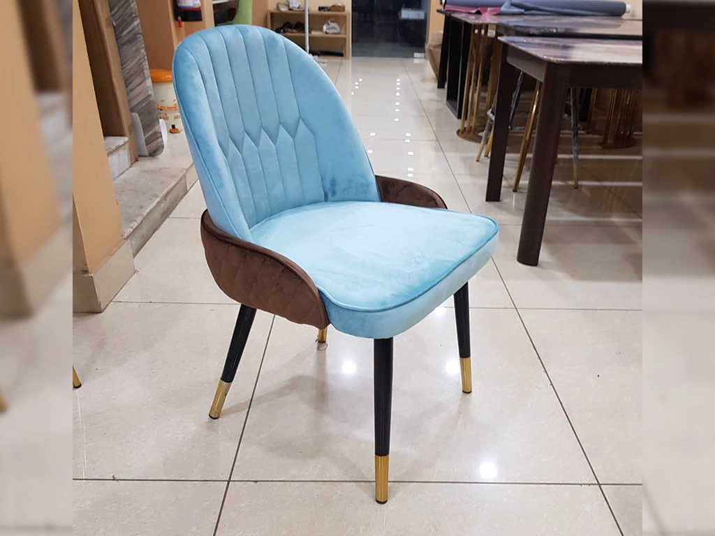 sky blue & Brown color Chair With velvet upholstered back and seat, stitching on backrest and back side of the chair, back round edges, metal black powder coated with gold cap finish legs.