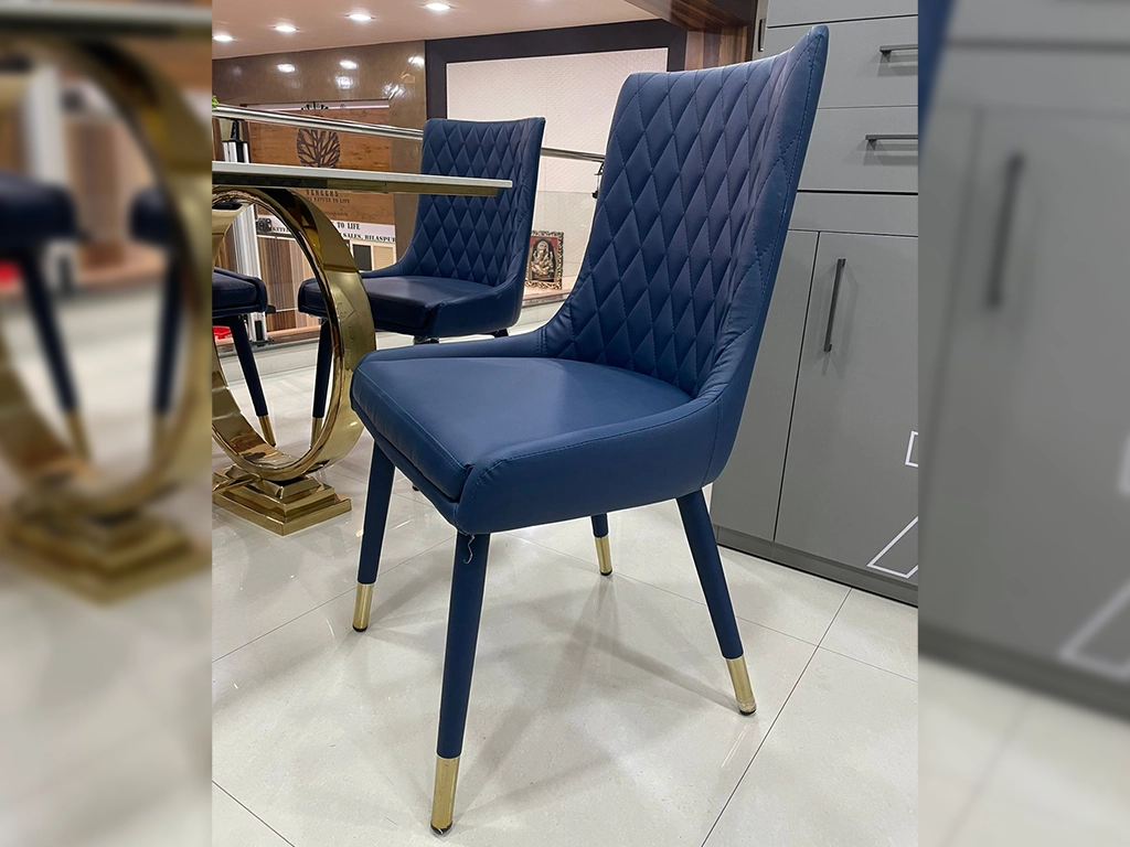 Blue color Chair With leatherette upholstered back and seat, diamond stitched design in back , metal legs over leatherette rolled legs finish with gold finish.