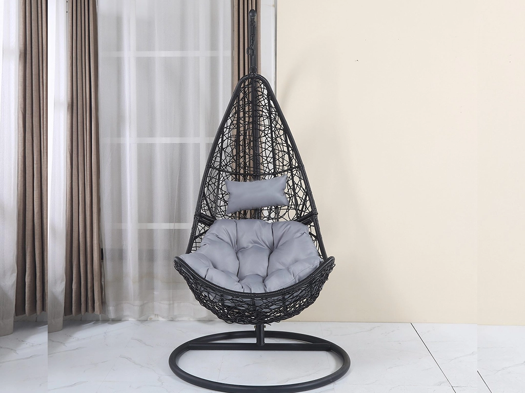 Black color single seater spoon design spider pattern swing chair with grey color cushion for balcony area.