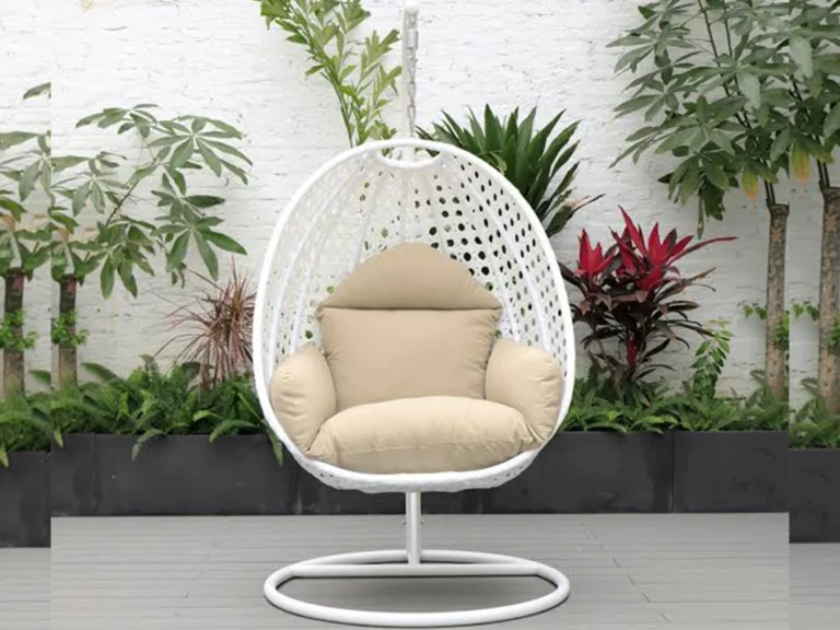 White color single seater swing chair & beige color cushion for balcony area.